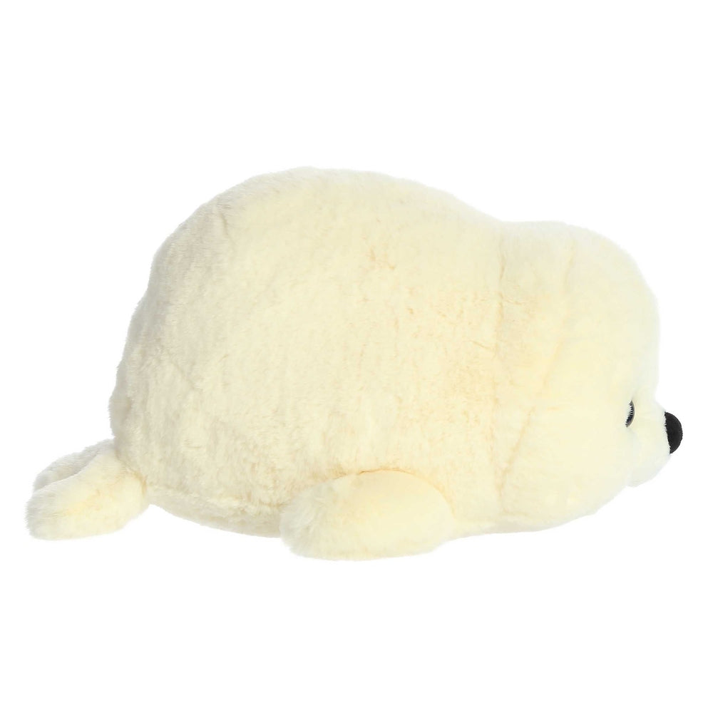 Aurora Spudsters Stella Seal 10" plush toy resting on its belly with soft cream fur.