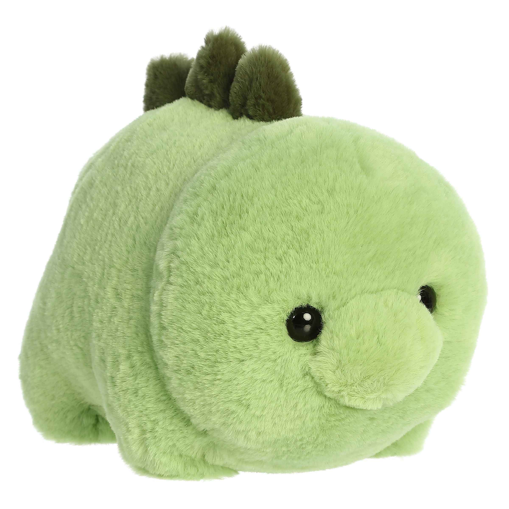 Aurora Spudsters Stevie Stegosaurus 10" plush toy, lime-green soft fabric with dark green spikes, resting on a surface.