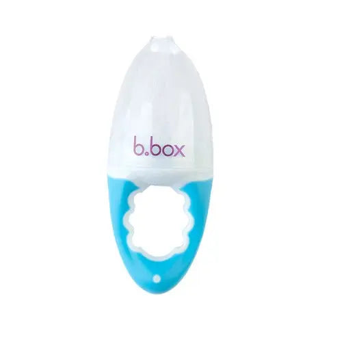 B.Box Fresh Food Feeder blue and white baby feeding accessory held ready for self-feeding.