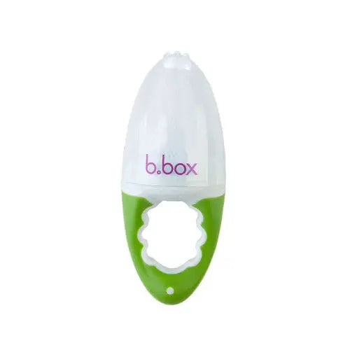 B.Box Fresh Food Feeder held by green handle with white silicone cup for safe baby feeding.
