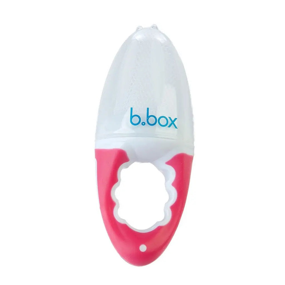 B.Box Fresh Food Feeder in pink handle with white ring, baby grips the ergonomic handle.