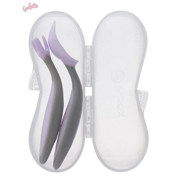 B.BOX New Cutlery Set for toddlers; two silicone-tipped utensils in purple and gray, stored in a clear case