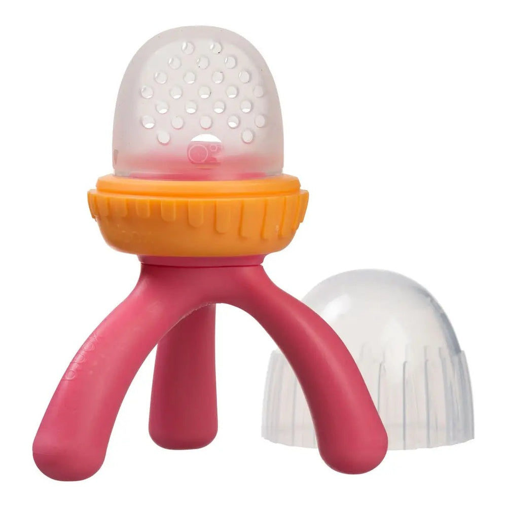 B.Box New Silicone Fresh Food Feeder with pink handles and orange ring, shown on its three-legged base.