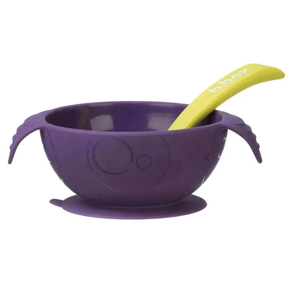 B.Box Silicone First Feeding Set: purple suction bowl with lime spoon, side handles, and suction base for steady baby feeding