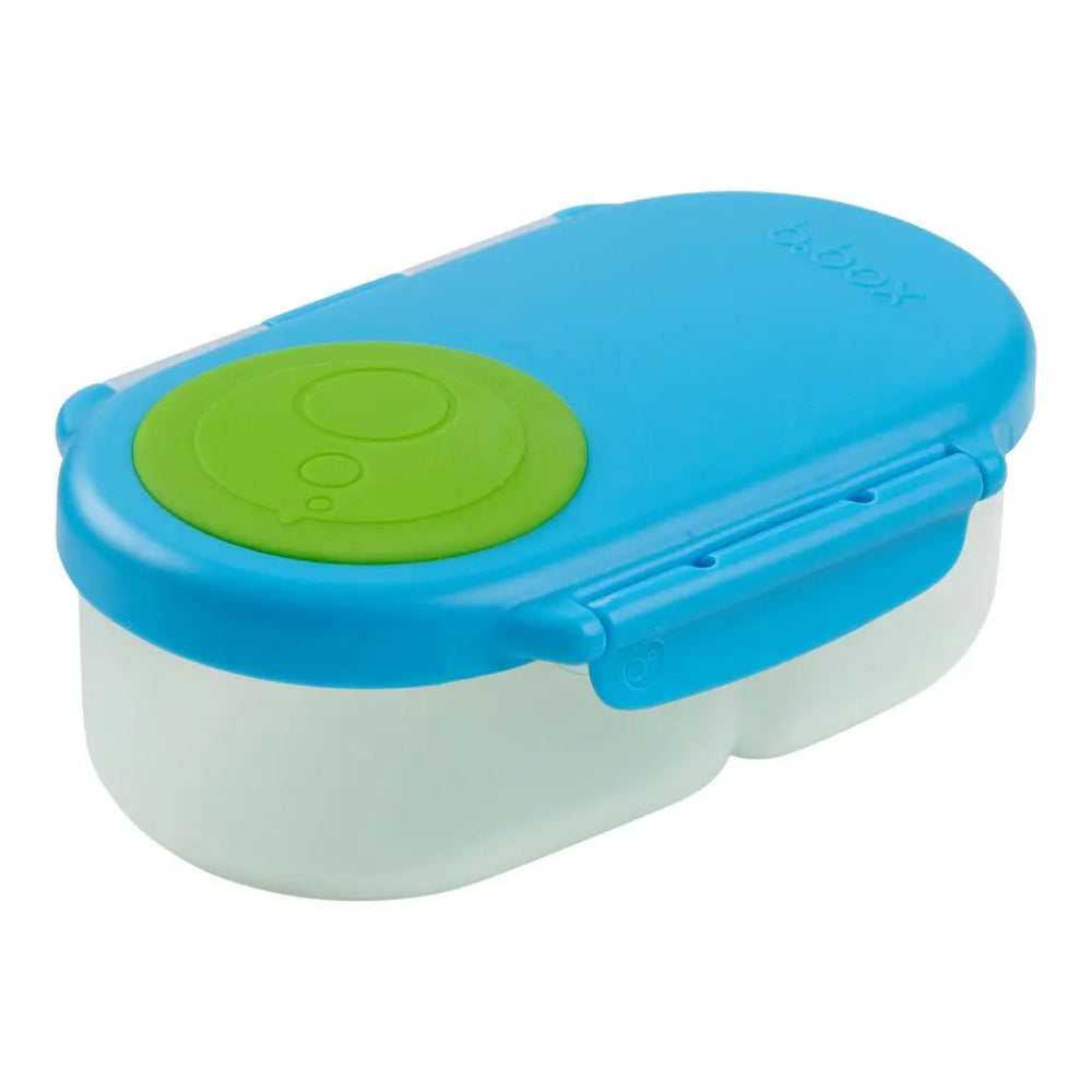B.Box Snackbox two-compartment lunch box with blue lid snapped closed, green seal visible.
