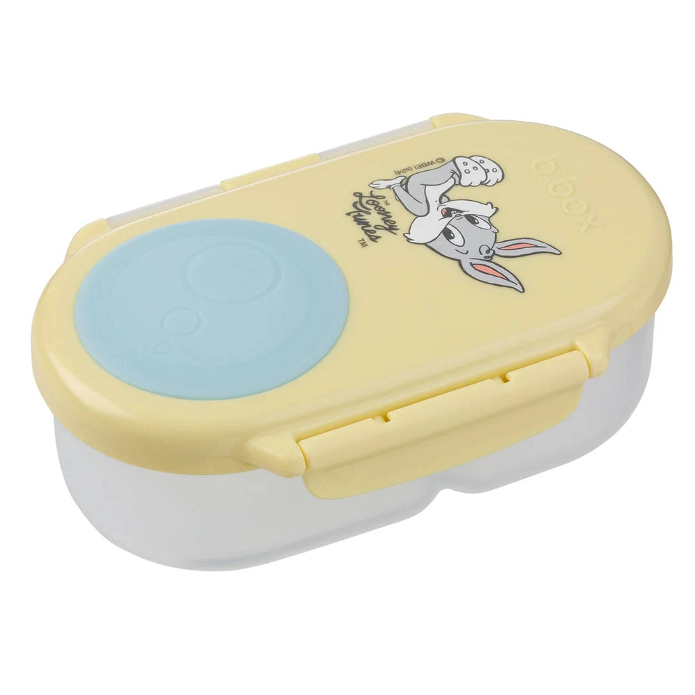 B.Box Snackbox with yellow lid and blue seal; side latch shows secure snap for snacks.