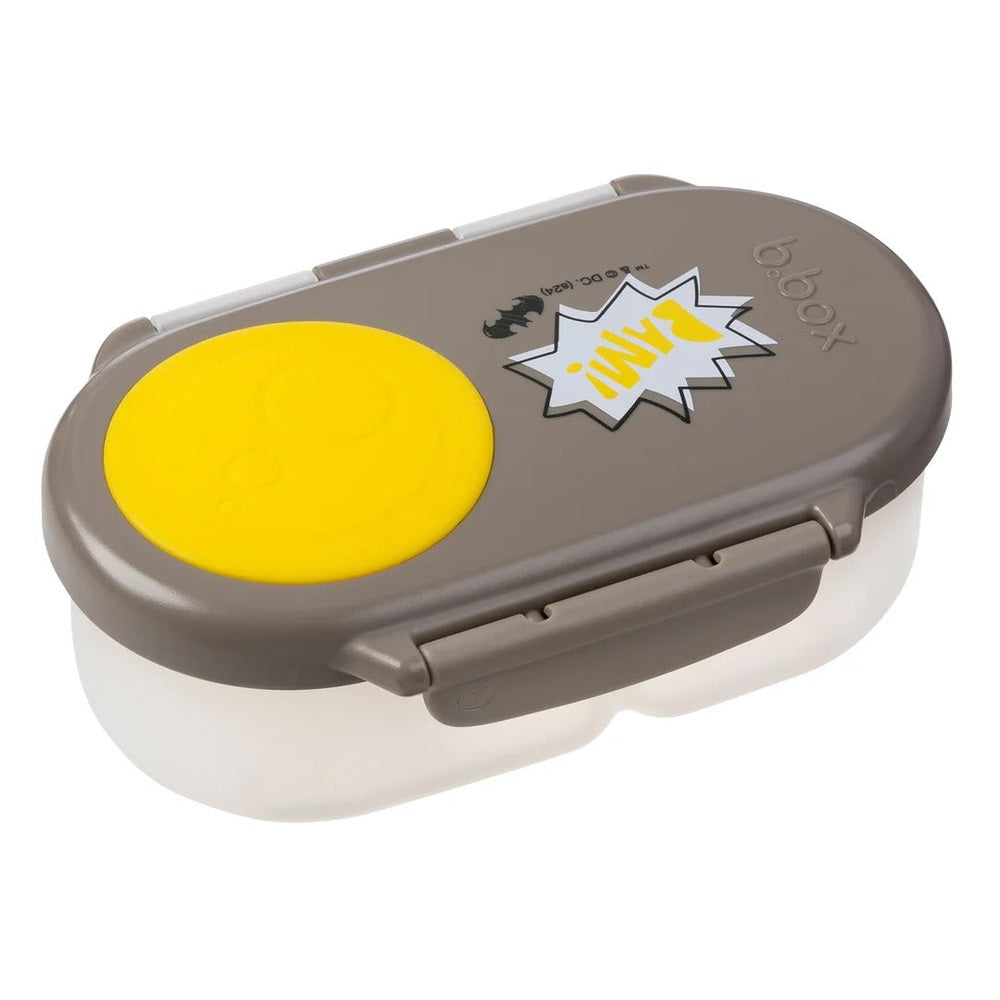 B.Box Snackbox in gray with Batman design featuring yellow silicone seal lid and comic-style graphics