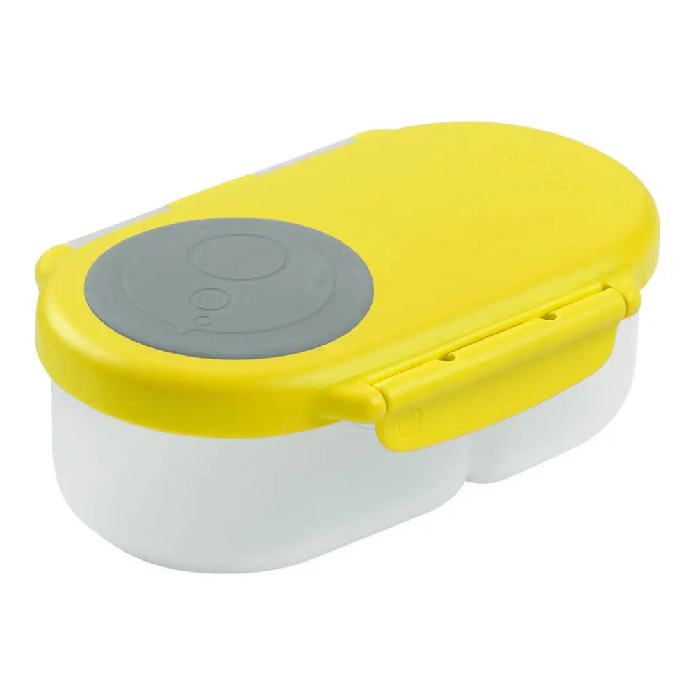 B.Box Snackbox lunch set with yellow lid, gray button, and twin white compartments shown snapped shut.