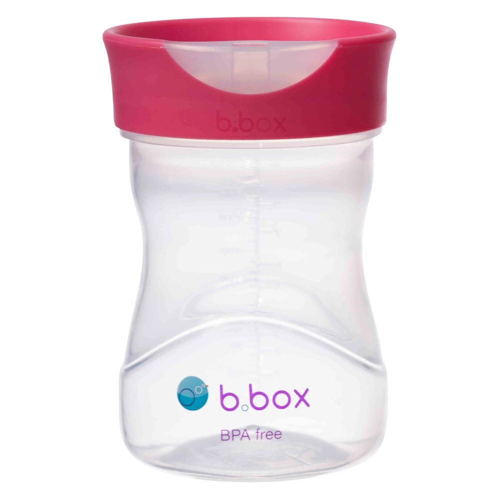 B.Box Training Cup with pink lid; BPA-free clear bottle featuring curved grip for easy hold.