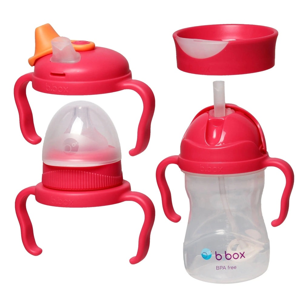 B.Box Transition Value Pack pink feeding set with two handled cups and BPA-free bottle with straw, ready for sipping.