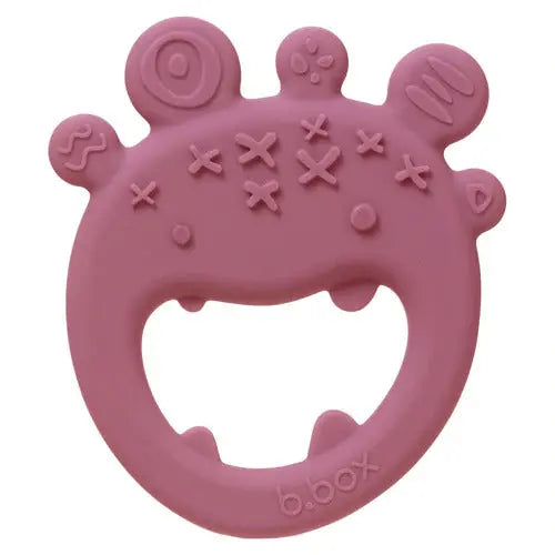 B.BOX Trio Teether pink silicone teether; baby grips the ring and chews the textured bumps.