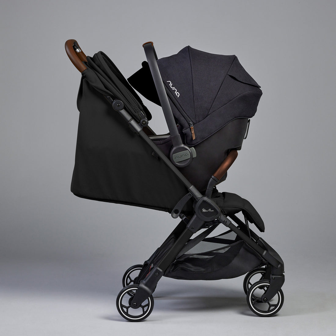 Silver Cross Clic stroller in Space with Nuna PIPA infant car seat in Caviar attached