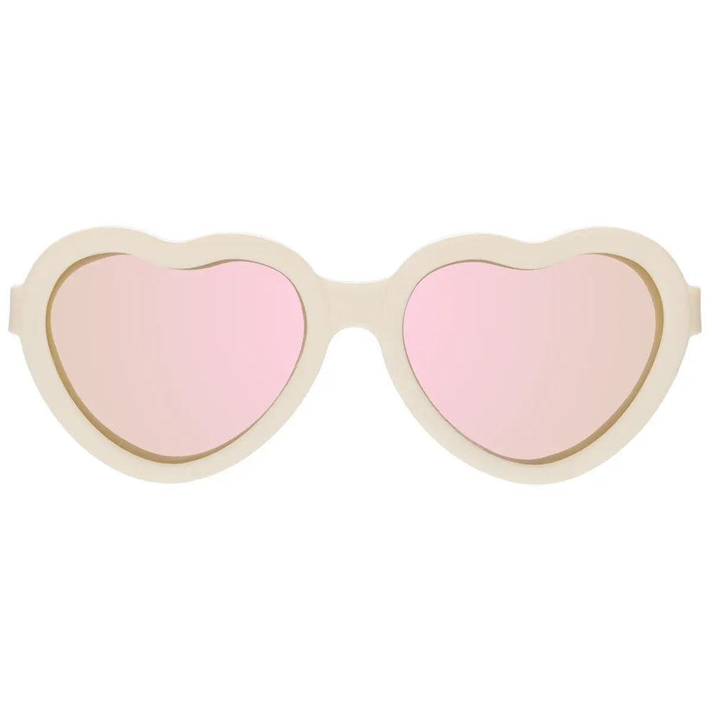 Babiators Polarized Mirrored Sunglasses Heart Shape Sweet Cream displayed with pink mirrored lenses
