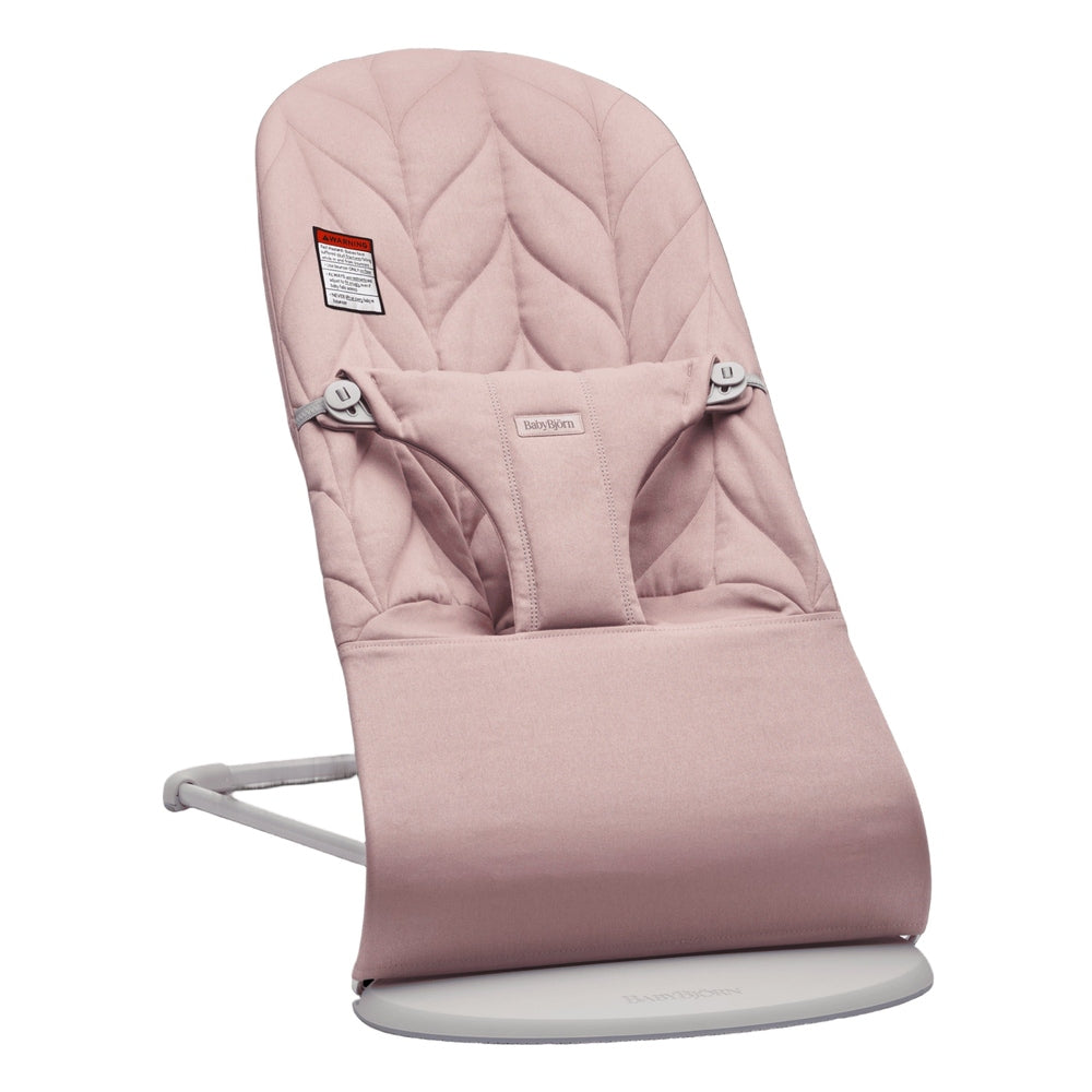 BabyBjörn Bouncer Bliss pink padded baby bouncer on a white stand, ready for gentle rocking.