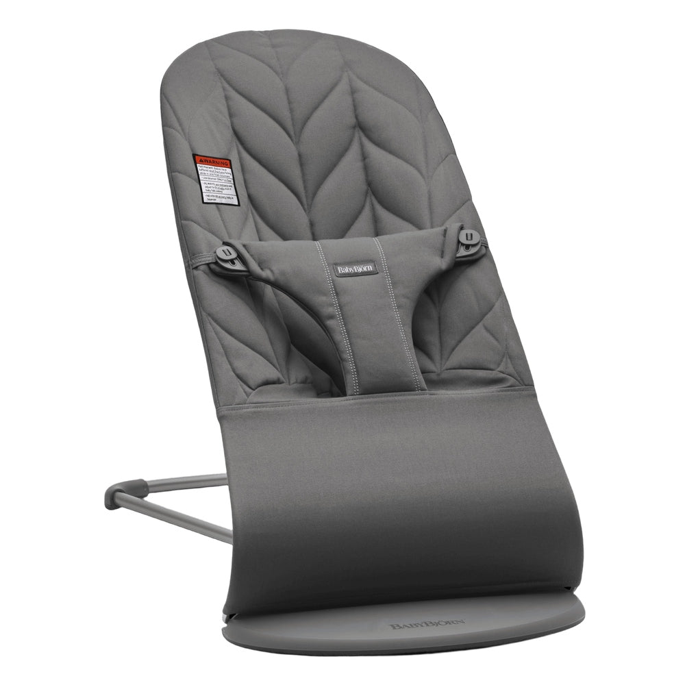 BabyBjörn Bouncer Bliss gray quilted seat with 5-point harness on a circular base stand.