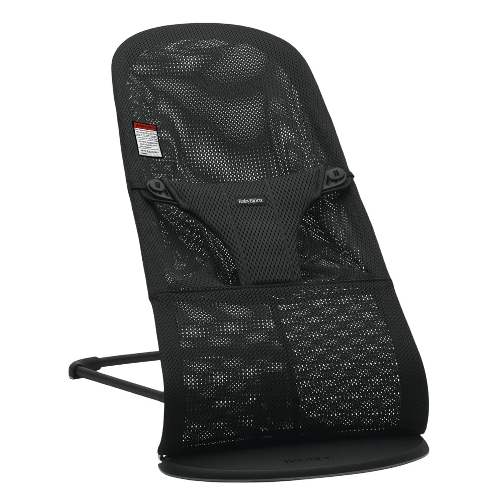 BabyBjörn Bouncer Bliss in black mesh, showing breathable seat and secure harness on its curved stand.