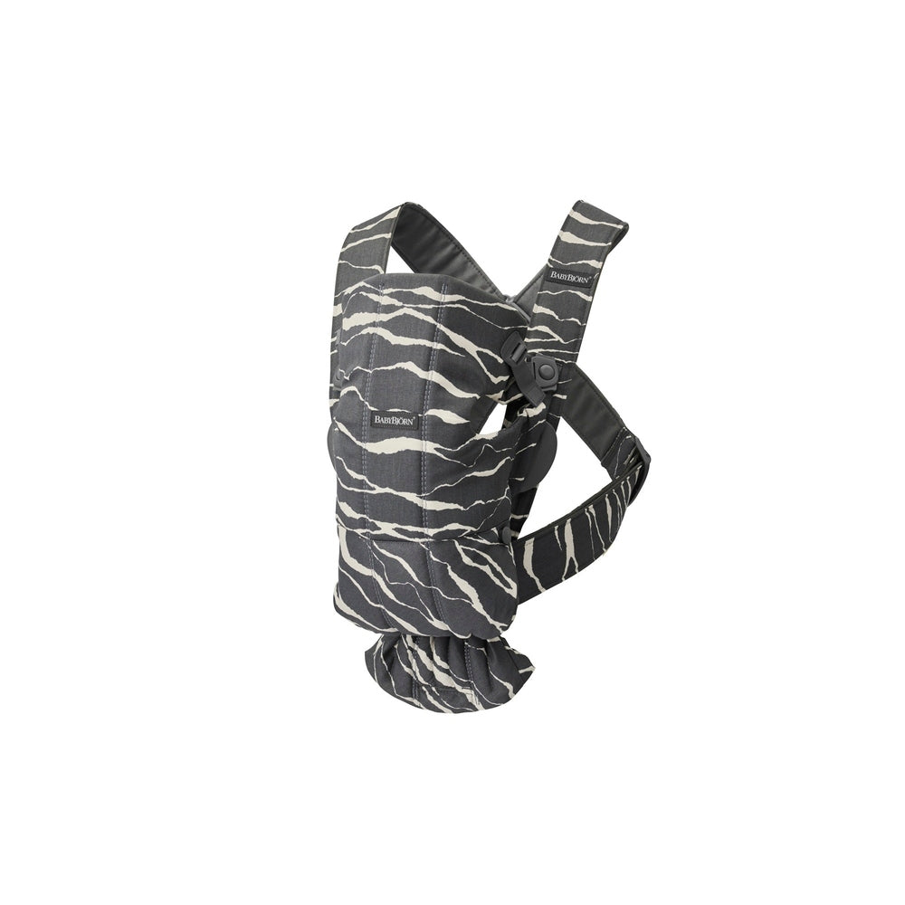BabyBjörn Bouncer Bliss Black Mesh Bundle with Baby Carrier Mini Landscape Holiday Bundle worn, showing black mesh fabric and ergonomic support.