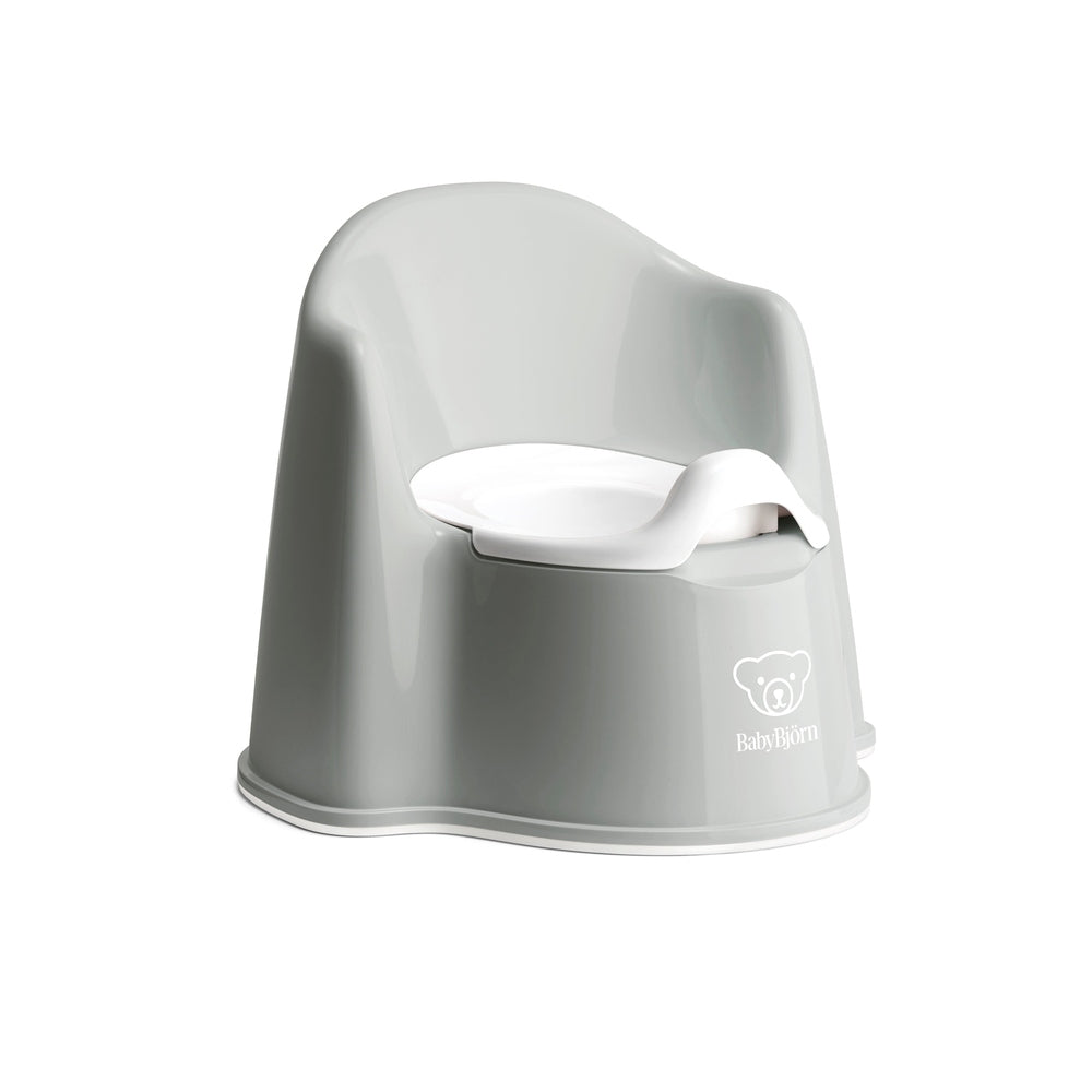 BabyBjörn Potty Chair in gray with white removable inner seat, showcasing ergonomic curved back and BABY BJÖRN logo.