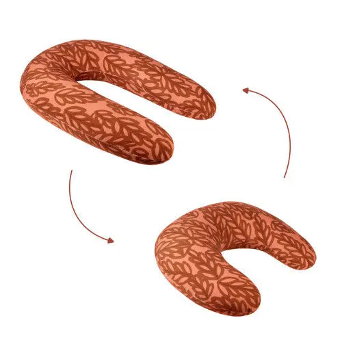 Babymoov B.Love 2-In-1 Nursing Pillow in orange pattern, demonstrated in two positions for versatile feeding support.