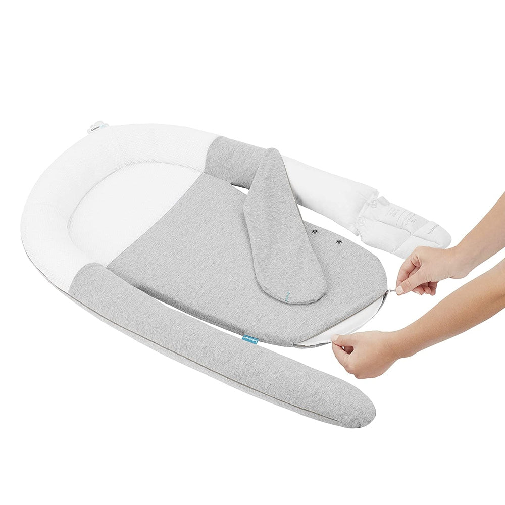 Babymoov Cloudnest Newborn Lounger in gray and white fabric with cushioned sides and removable cover