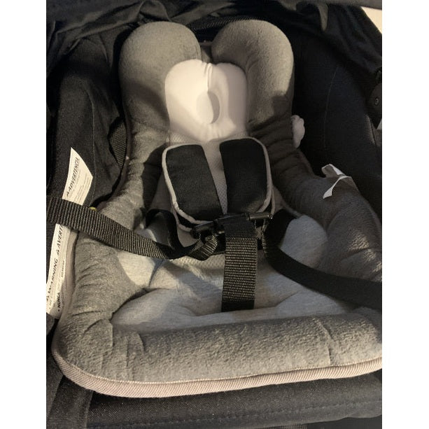 Babymoov Cozymorpho Smokey infant carrier interior in grey with padded harness straps