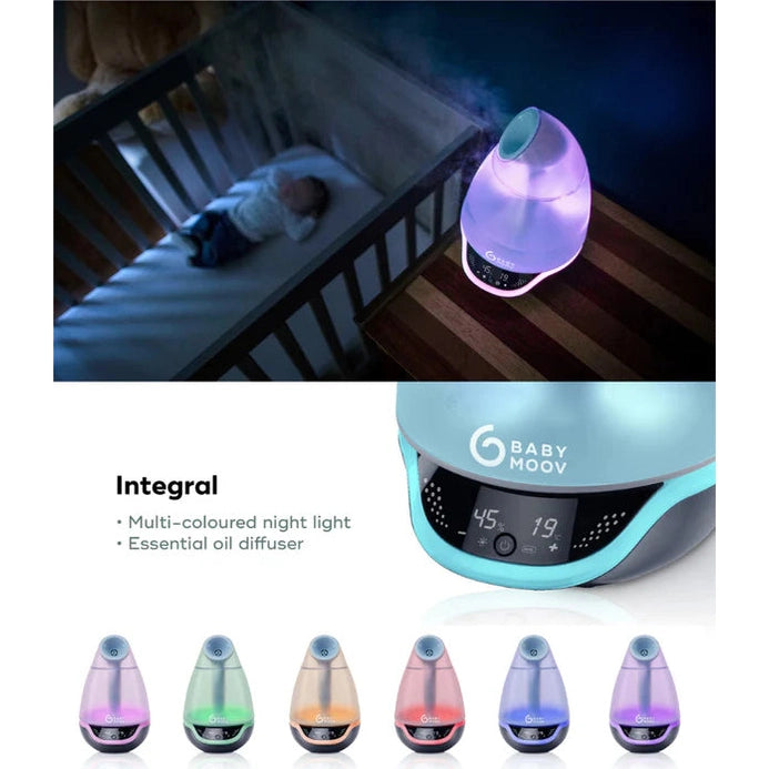 Babymoov Hygro Plus 3-In-1 Baby Humidifier in lavender glow, releasing mist beside a crib with soothing night light.