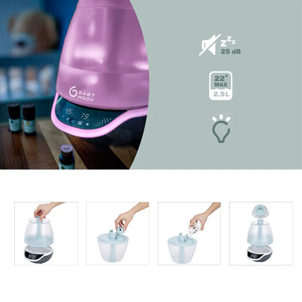 Babymoov Hygro Plus 3-In-1 Baby Humidifier in purple with 2.5L tank, user adjusts settings on the digital panel.
