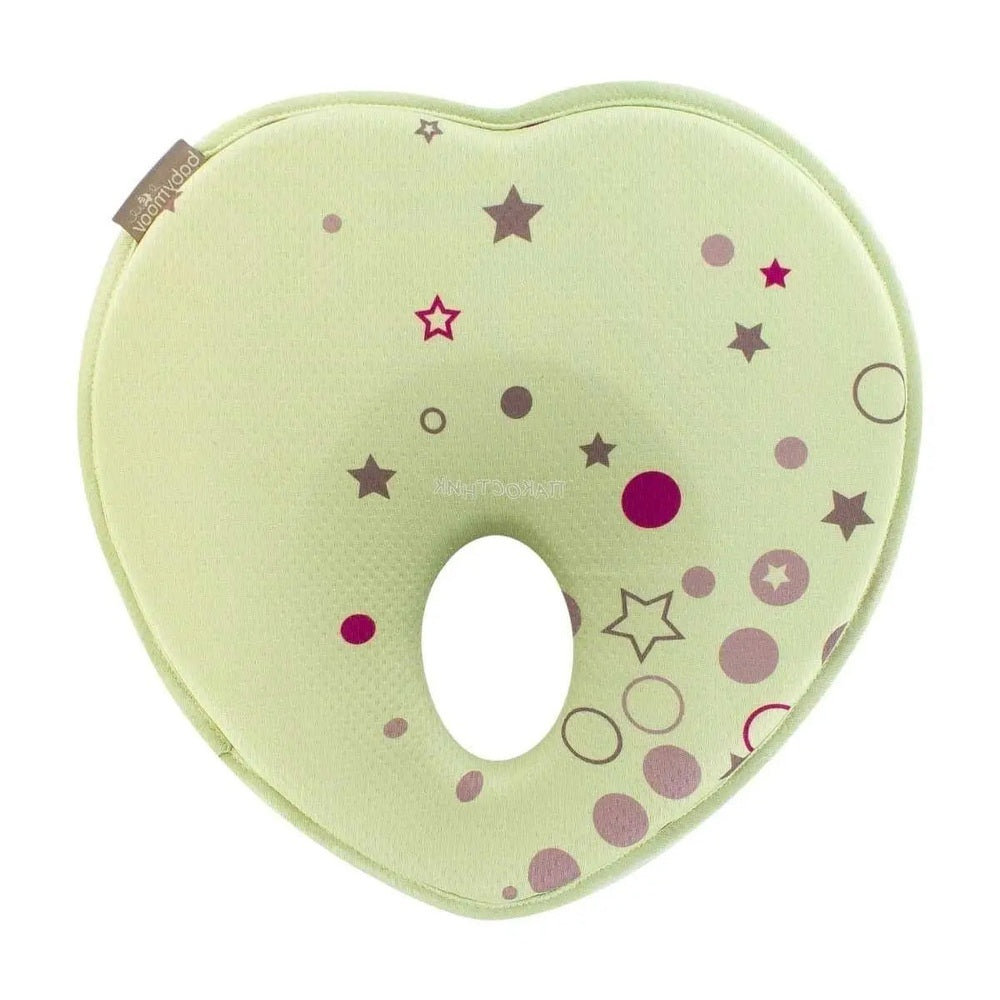 Babymoov Lovenest Pillow lime green nursing pillow in a curved U-shape with star and circle print.