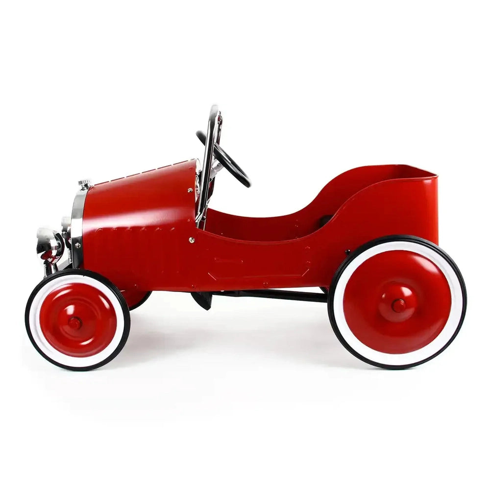 Baghera Ride-On Classic Pedal Car red with whitewall wheels; child grips steering while pedaling.