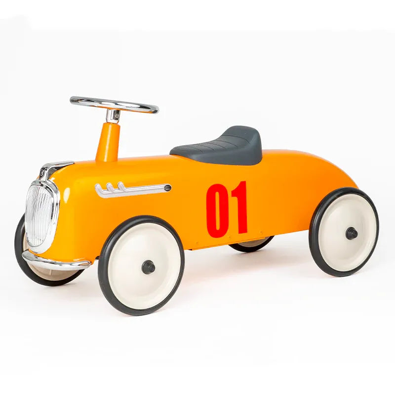Baghera Ride-On Roaster Camel orange pedal car with gray seat, 01 decal, and front steering wheel.