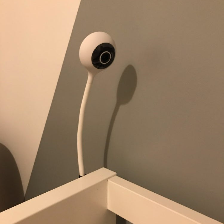 BBLUV wifi baby monitor camera in white with circular lens mounted on a crib rail