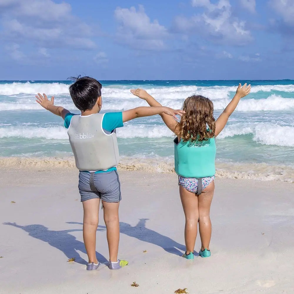 Bbluv Naj Evolutive Neoprene Swim Vest Grey; two children on a sunny beach wear