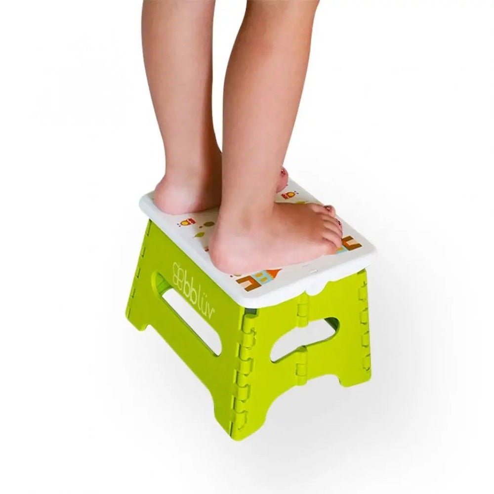BBLUV Step Folding Step Stool in lime green with white top; child stands on it.
