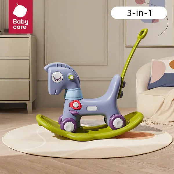 BC Babycare 3-In-1 Rocking & Sliding Horse toy, blue with lime-green rockers, handle at rear for pushing.