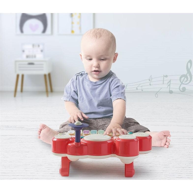 BC Babycare Baby Piano Drum red plastic toddler musical toy with multiple drums and a blue control knob