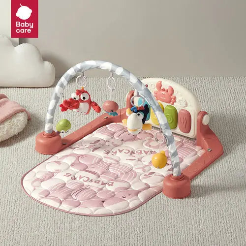BC Babycare Bluetooth Kick & Play Piano Gym with pink quilted mat, arch with hanging toys for baby kick-and-play.