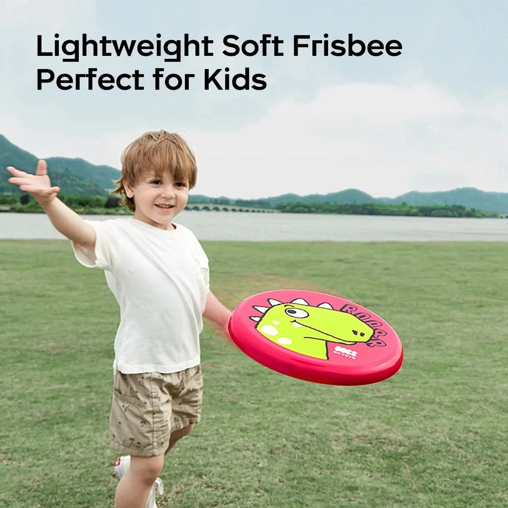BC Babycare Children Soft Frisbee, pink with a green dinosaur graphic, kid playing outdoors