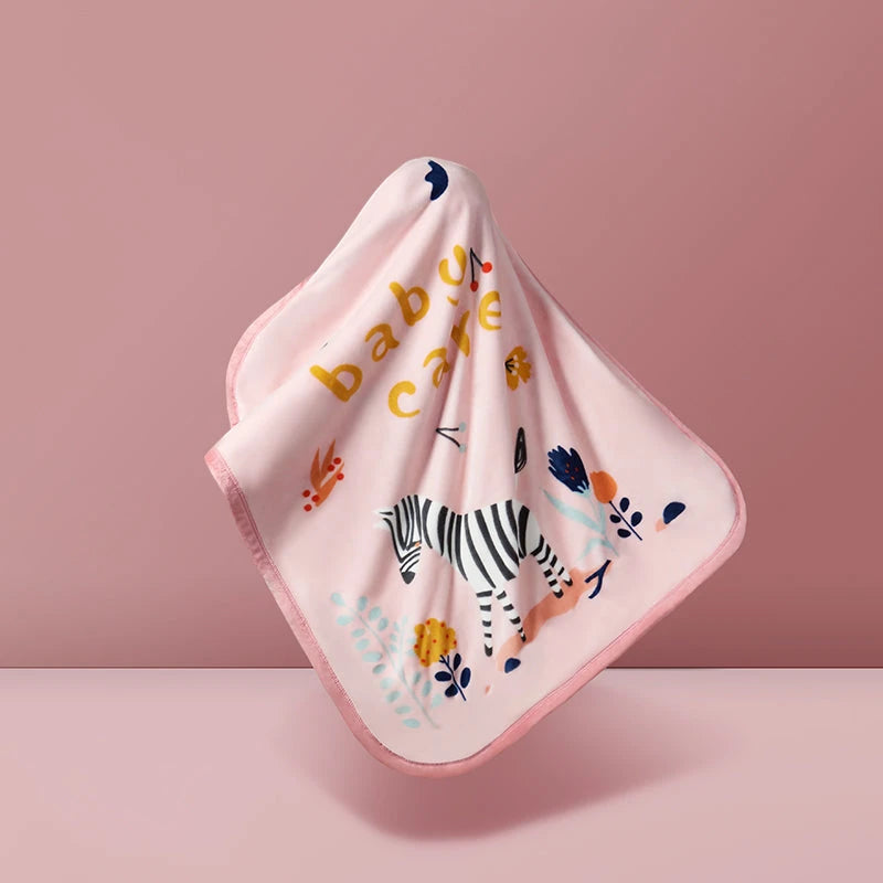 BC Babycare Cozy Blanket Dual Layer Zebra pink baby blanket being held aloft to show zebra print and botanical accents