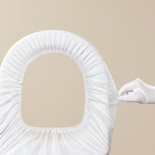 Bc Babycare disposable white toilet seat cover with elastic edge, protective baby restroom accessory.
