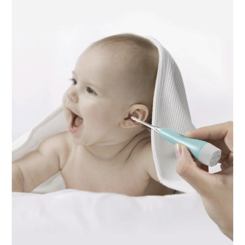 BC Babycare Ear Wax Removal Kit for babies with teal-handled tool near infant's ear