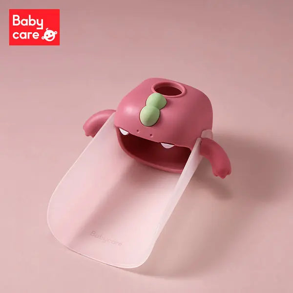 Bc Babycare Faucet Extender in pink with a green top and white ramp extending for toddler bath time.