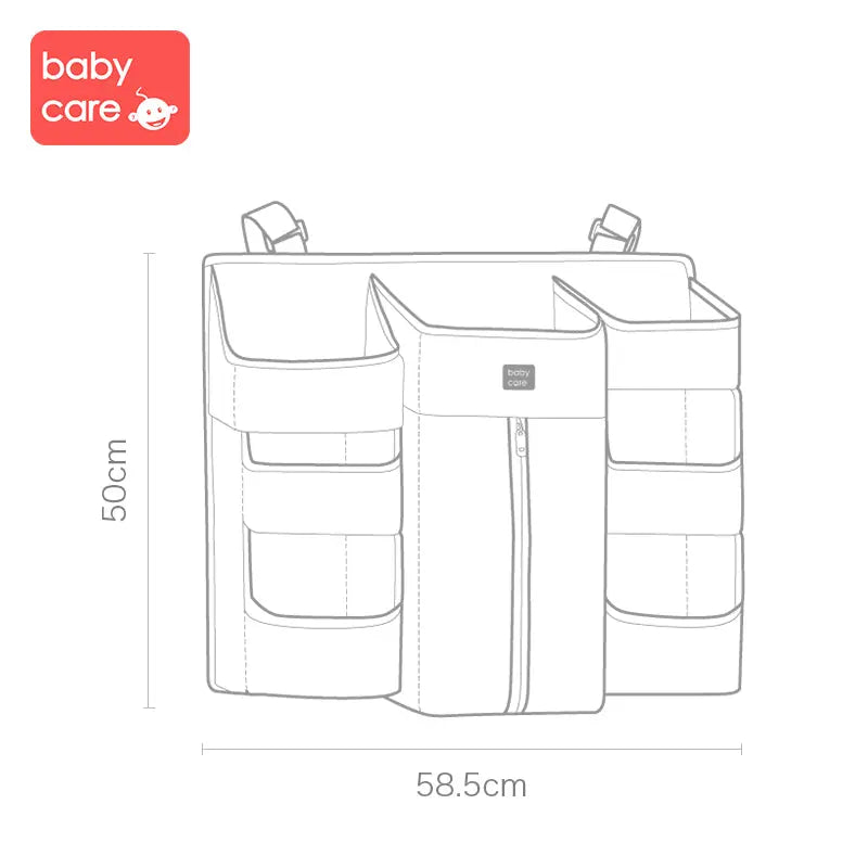 BC Babycare Hanging Storage Bag with multiple pockets and center zip, hanging from a rail (58.5x50 cm).