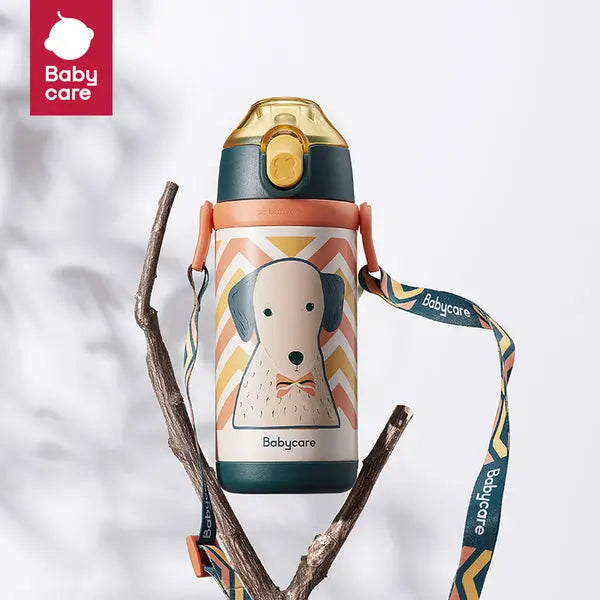 Bc Babycare Kids Vacuum Bottle 350 ml with teal lid and dog illustration, hanging from a patterned strap.