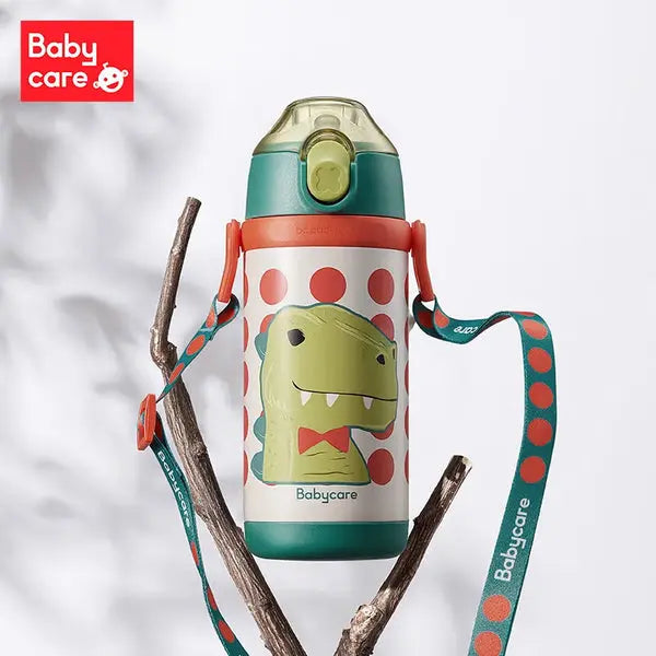 BC Babycare Kids Vacuum Bottle 350 ml with green dinosaur graphic, teal lid, and strap hanging from a branch.