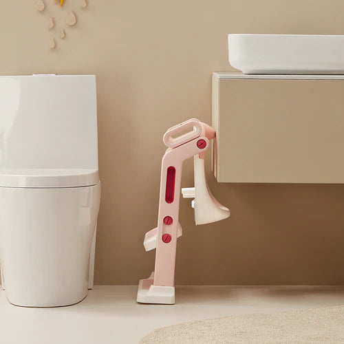 BC Babycare ladder potty training seat in pink with white base beside a modern toilet
