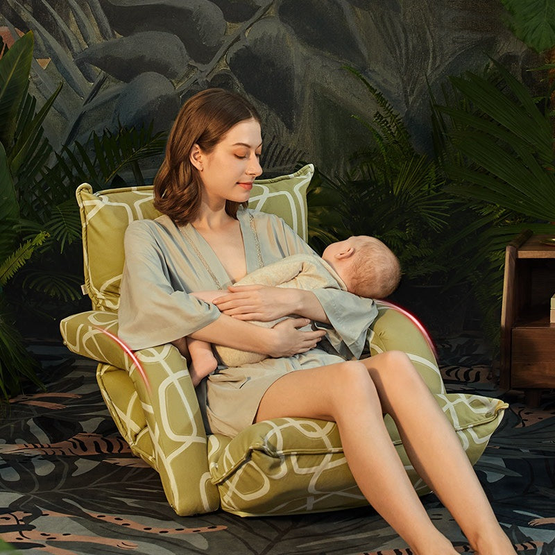 BC Babycare latex stuffed adjustable nursing chair in green geometric fabric with mother nursing baby