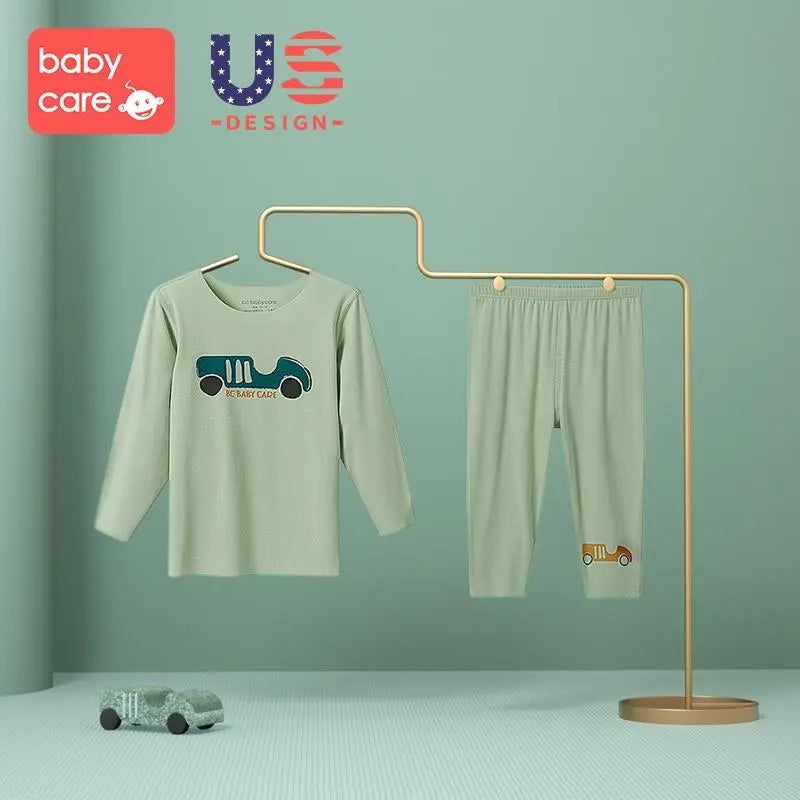 Bc Babycare Modal Sleepsuit Green two-piece set on a display rack with matching pants and a nearby toy car.