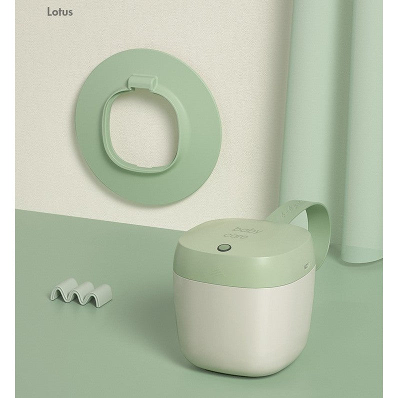 BC Babycare portable UV sterilizer; mint green and white compact bottle sterilizer with handle.