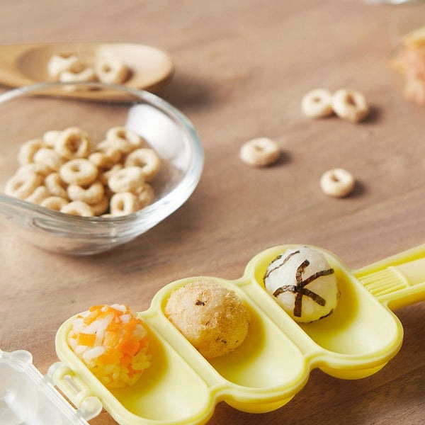 BC Babycare Rice Ball Maker, yellow silicone mold with three compartments for baby feeding