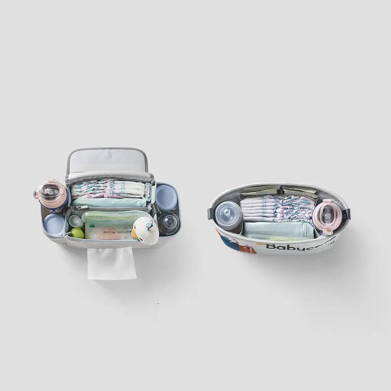 BC Babycare Stroller Organizer, grey fabric, set of 2, opened to show bottle pockets and neatly stored essentials.